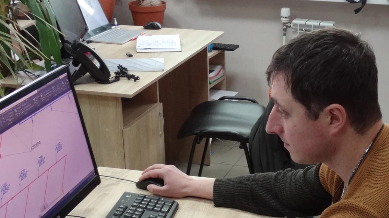 VENTALL engineer works on a ventilation system layout at a computer during the design stage.